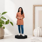 Personalized photo cutout of a woman in a rust dress standing on a black base