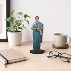 Personalized photo cutout of a woman in a teal sari holding a coin on a black base