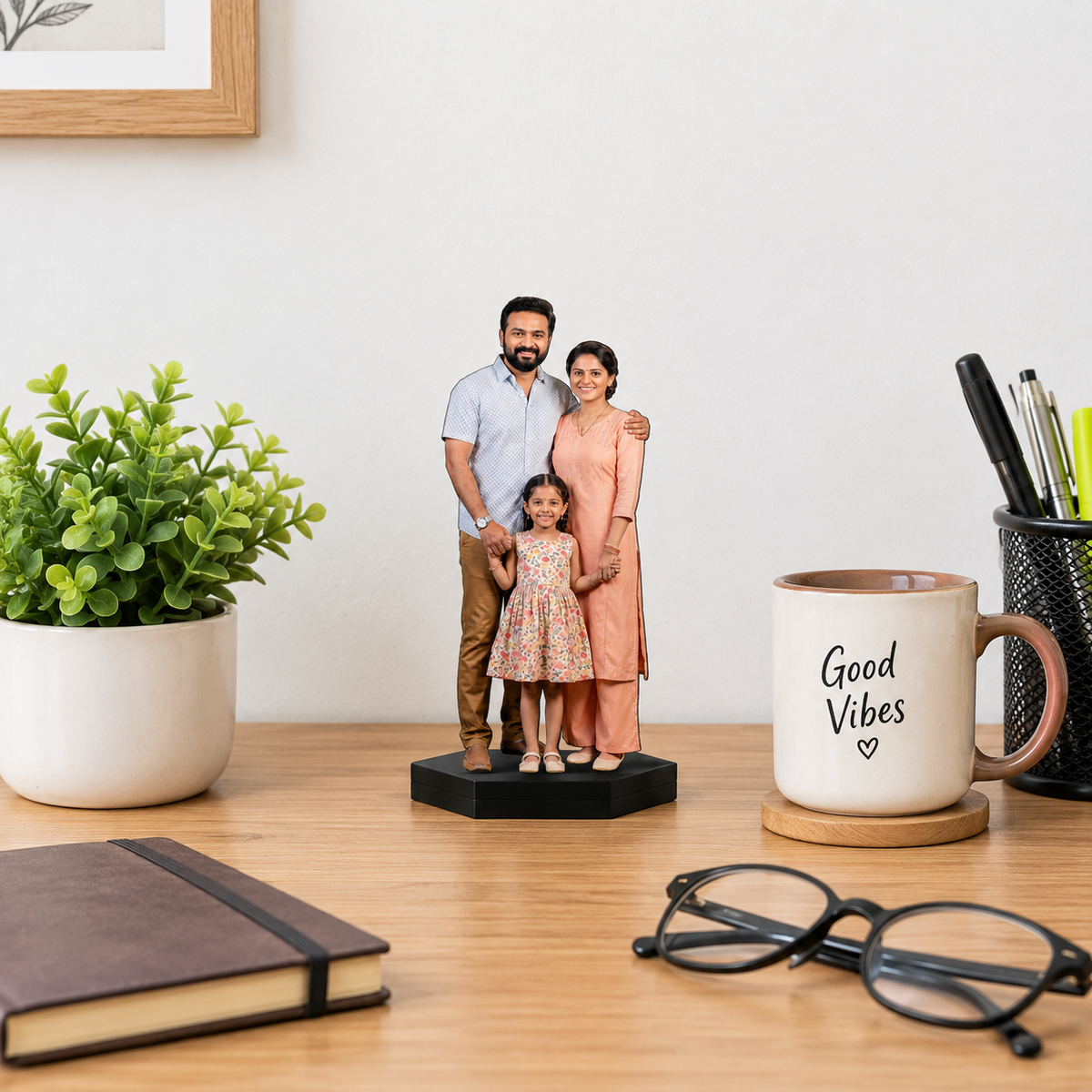 Personalized photo cutout display of family of three on black base