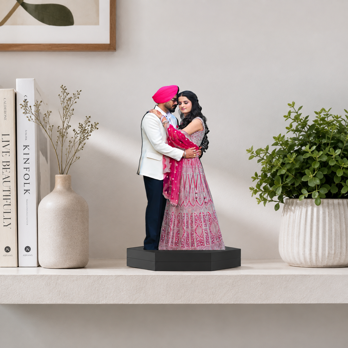 Personalized photo cutout display of couple in pink and white outfits on black base