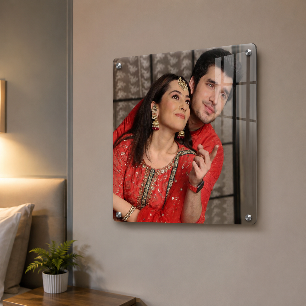 Square acrylic photo frame with rounded corners and visible metal corner mounts