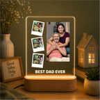 LED acrylic photo frame with three photos and one large portrait, on wood base.