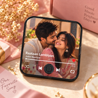Music photo fridge magnet with photo screen, play controls, and red heart icon