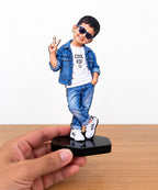 Personalized photo caricature display figurine of a smiling child in denim outfit on base